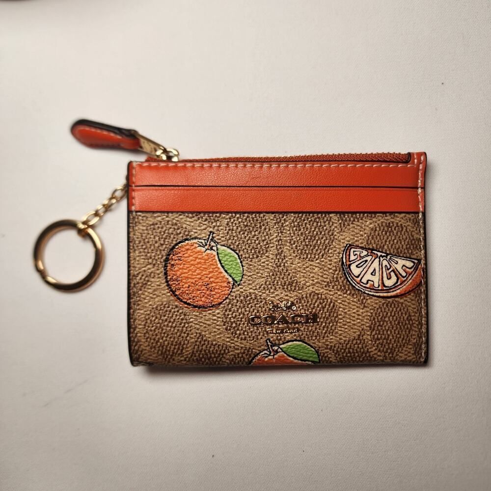 NWT Coach CAR21 Mini Skinny Id Case In Signature Canvas With Orange Print In Tan